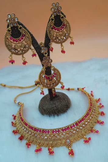 Ethnic Golden Necklace Set In Pink Color